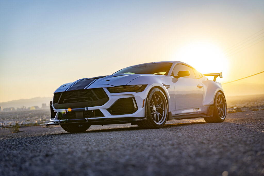 Built on the S650 Ford Mustang Dark Horse platform, Super Snake R is a widebody track specialist with road manners. A supercharged 5.0-litre Coyote V8 unleashes 850+ hp, paired to a Tremec TR-3160 six-speed manual or a ten-speed automatic. Cooling, driveline and exhaust upgrades let it deliver hot laps repeatedly, then cruise home in comfort. It looks like a race car because it is engineered like one.In right hand drive and only from Autogroup International