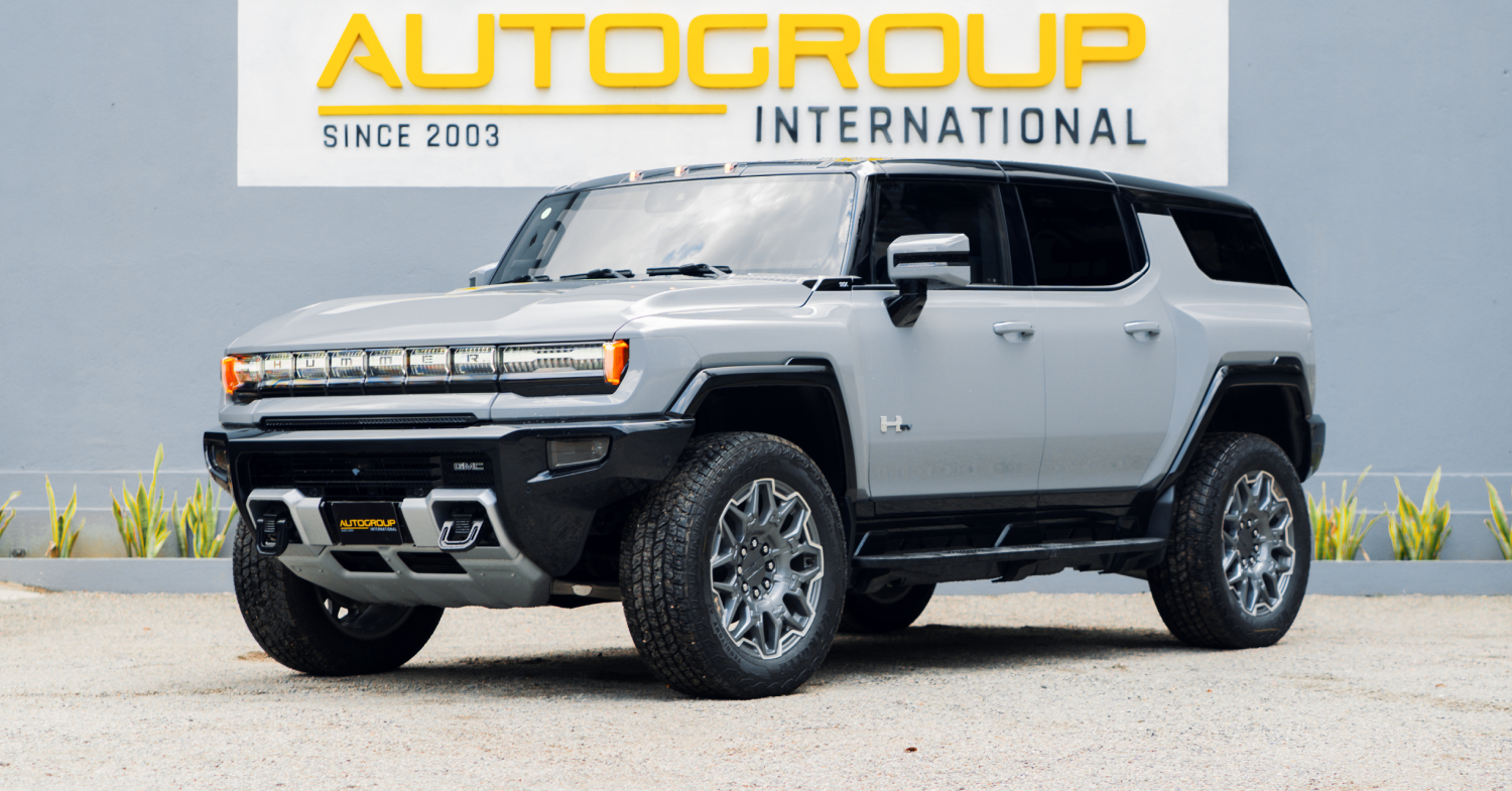 Silver GMC Hummer EV parked outside dealership