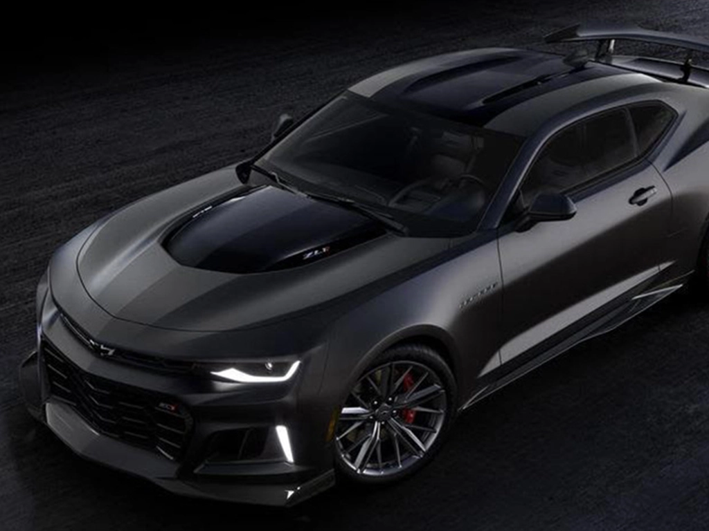 Gray Chevrolet Camaro on dark background.